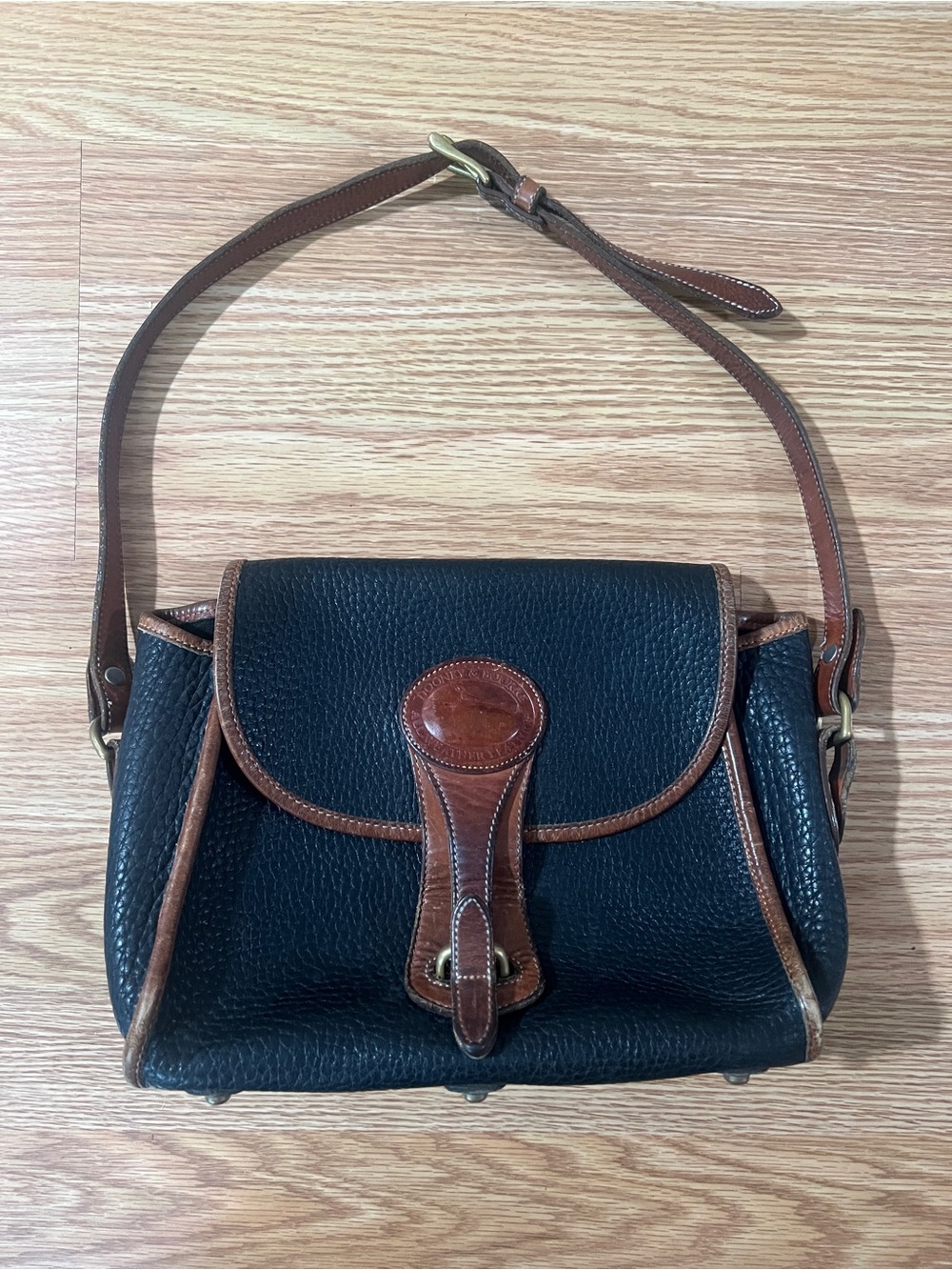 Dooney & Bourke Black Pebbled Leather Shoulder Bag with Brown Trim